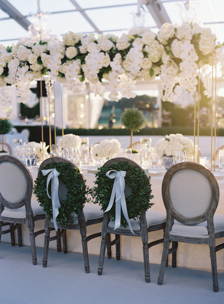 Celebrity Wedding with Boxwood Wreaths as Chair Back Decor