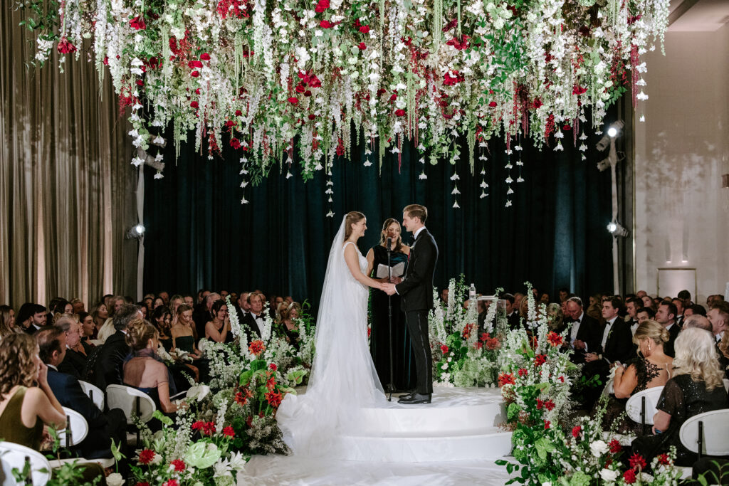 Holiday Wedding with Suspended Flowers overhead a romantic ceremony
