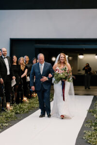 Bride being walked down the aisle by father of the bride at 167 Events Wedding Venue