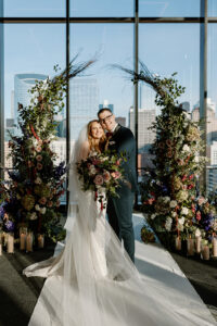 Deconstructed Floral Arch with bride and groom in front